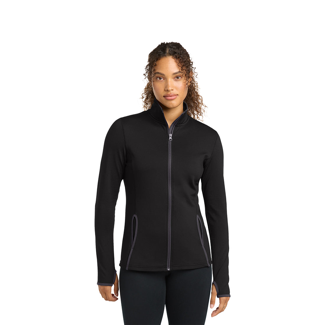 Woman in a black zip up on a white background