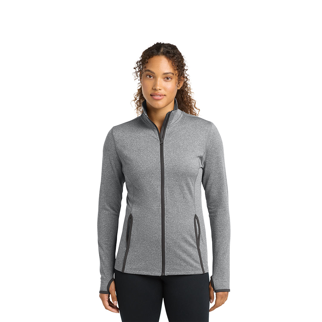 Woman wearing a gray zip-up jacket on a white background