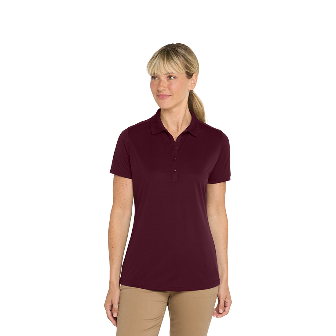 Woman wearing a maroon polo shirt on a white background