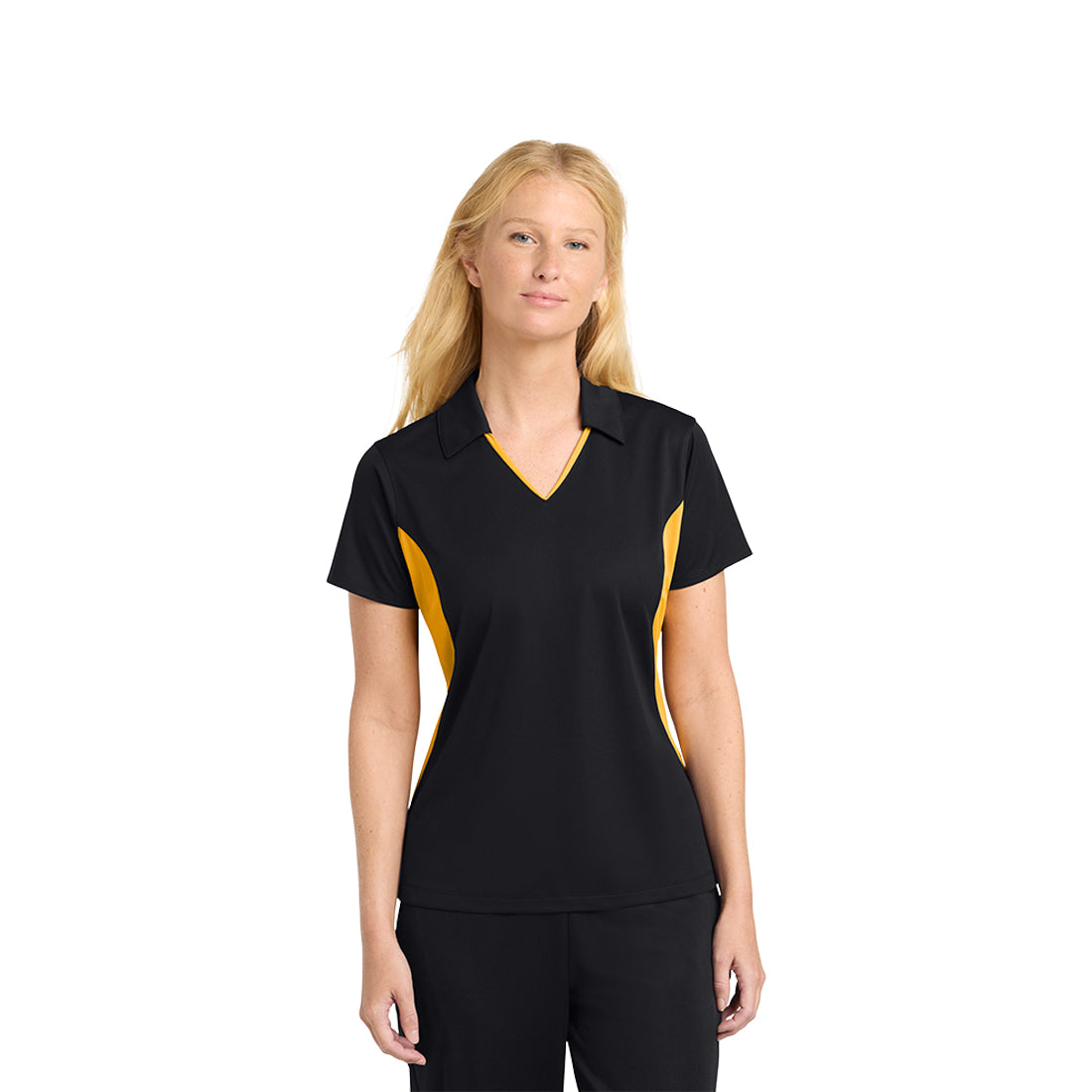 Woman wearing a black and gold polo shirt on a white background
