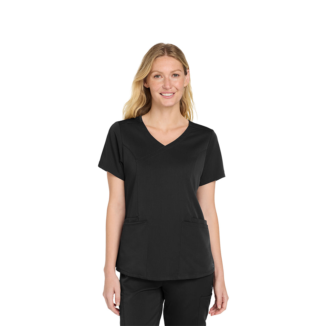 Woman wearing a black scrub set on a white background