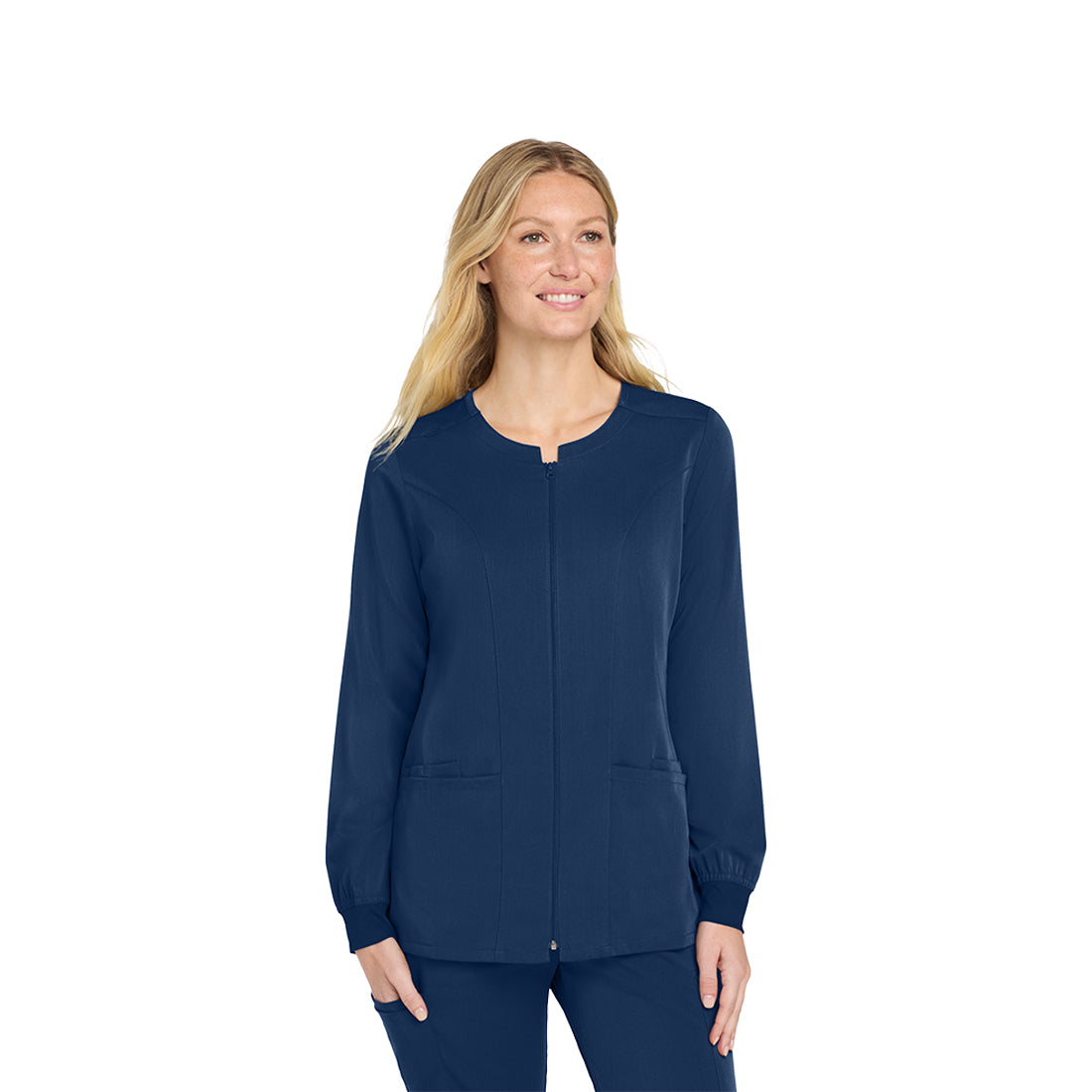 Woman wearing a navy blue scrub top on a white background