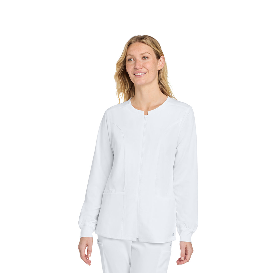 Woman wearing a white scrub top and pants on a white background