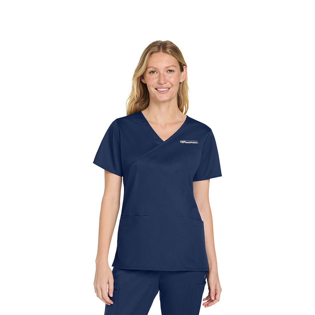 Woman wearing a navy blue scrub set on a white background