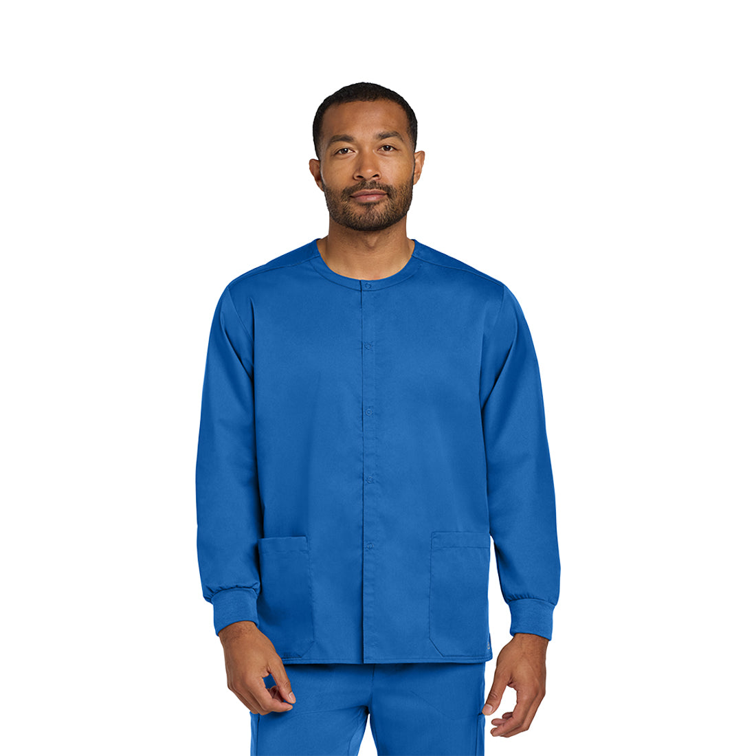 Man wearing a blue scrub set on a white background