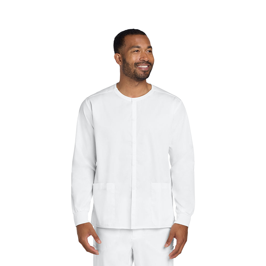 Man wearing a white scrub set on a white background