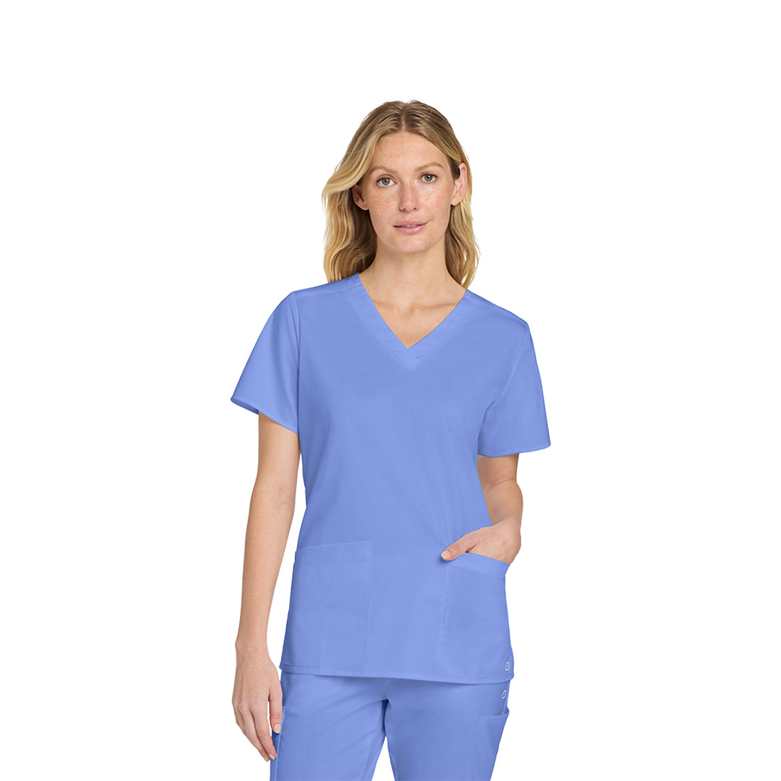 Woman wearing a light blue scrub set on a white background
