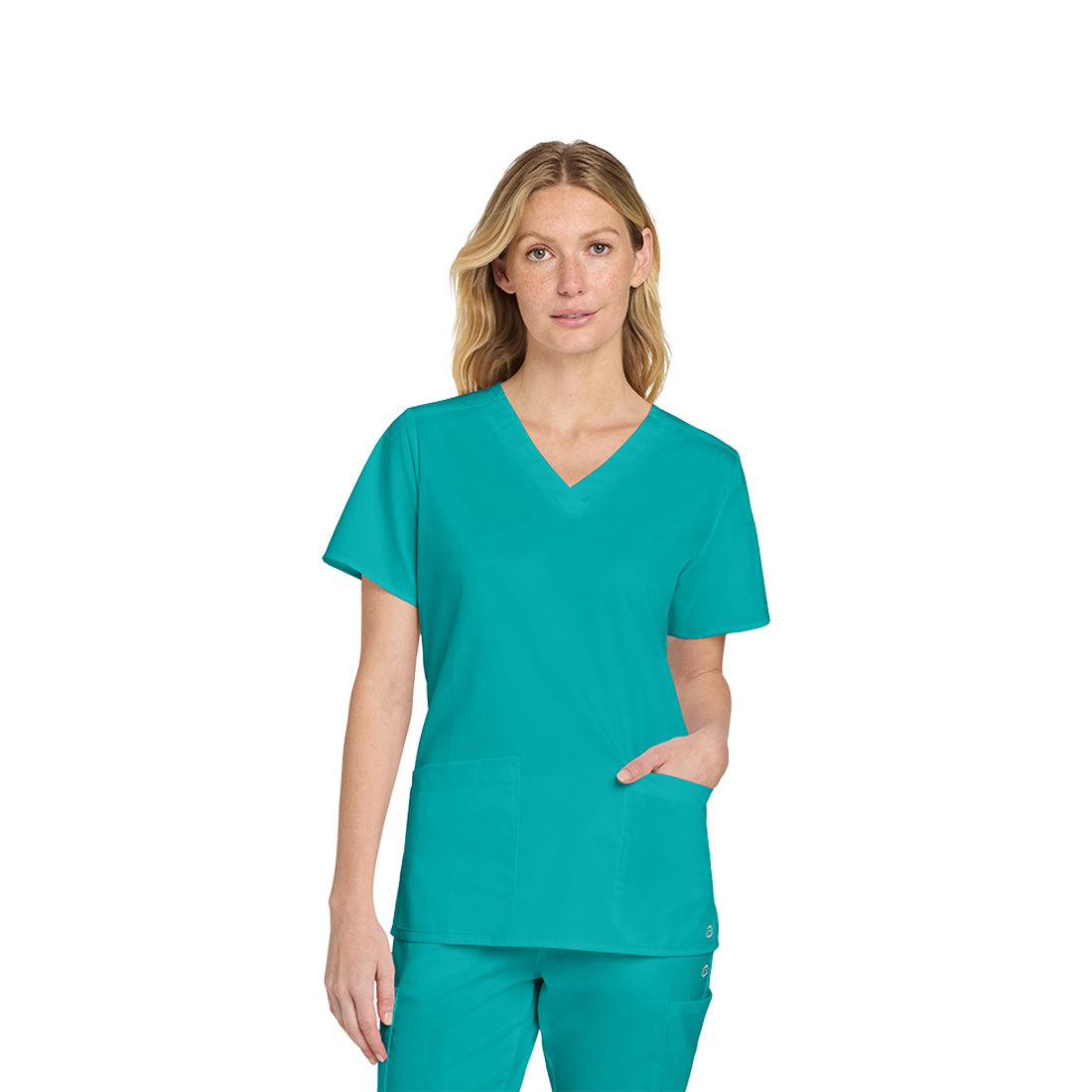 Woman wearing a teal scrub set on a white background