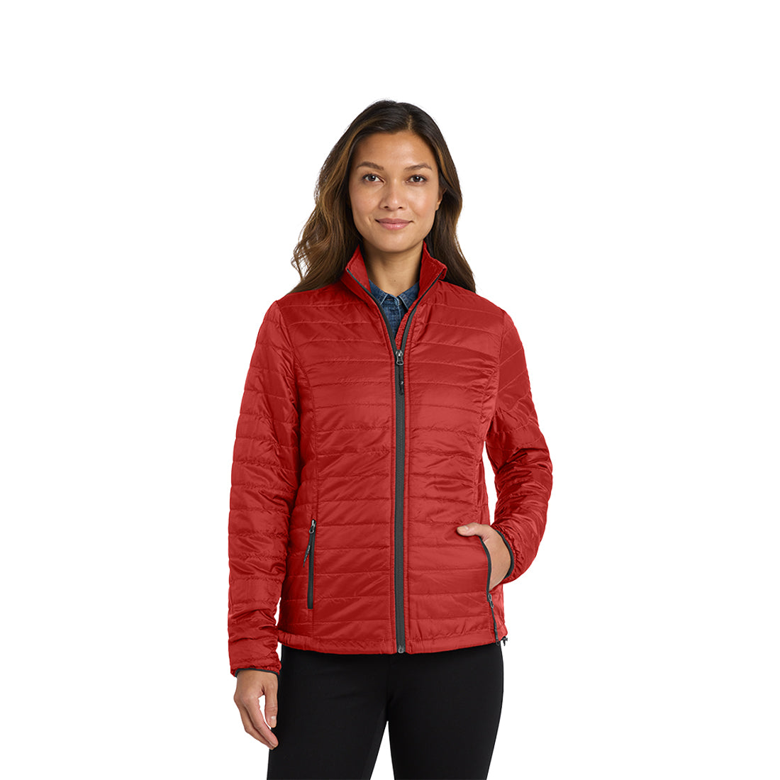 Woman in a red puffy jacket with gray zippers on a white background