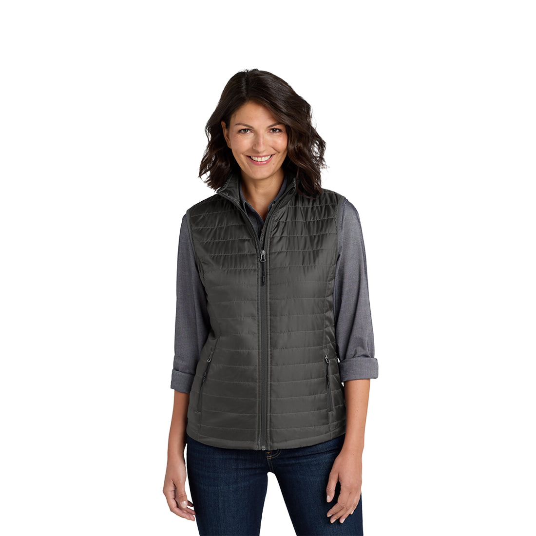 Woman wearing a gray quilted vest on a white background