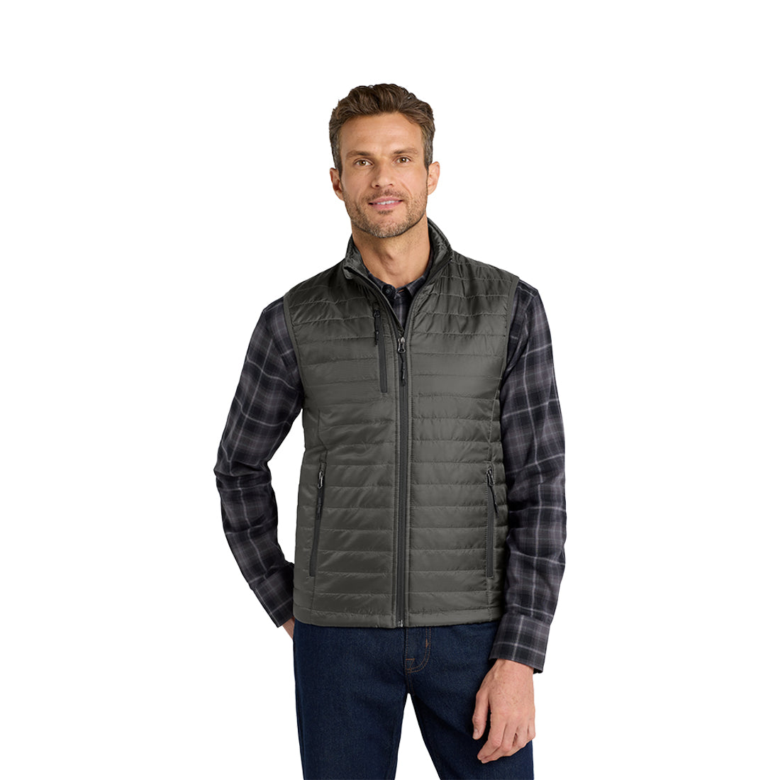 Man wearing a dark gray quilted vest over a dark shirt on a white background