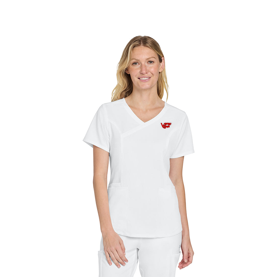 Woman wearing a white scrub top with a red logo on a white background