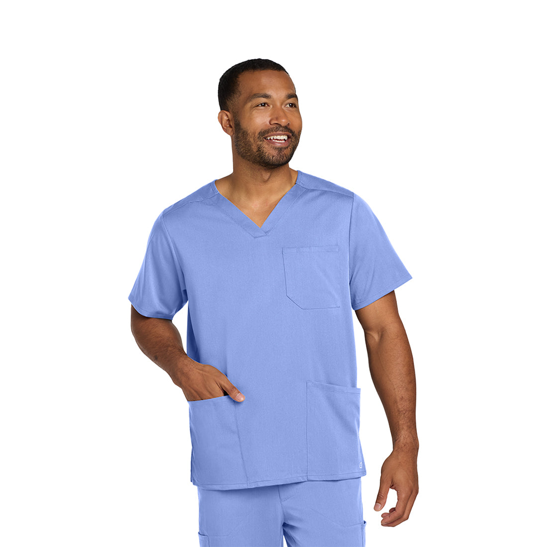 Man wearing a light blue medical scrub set on a white background