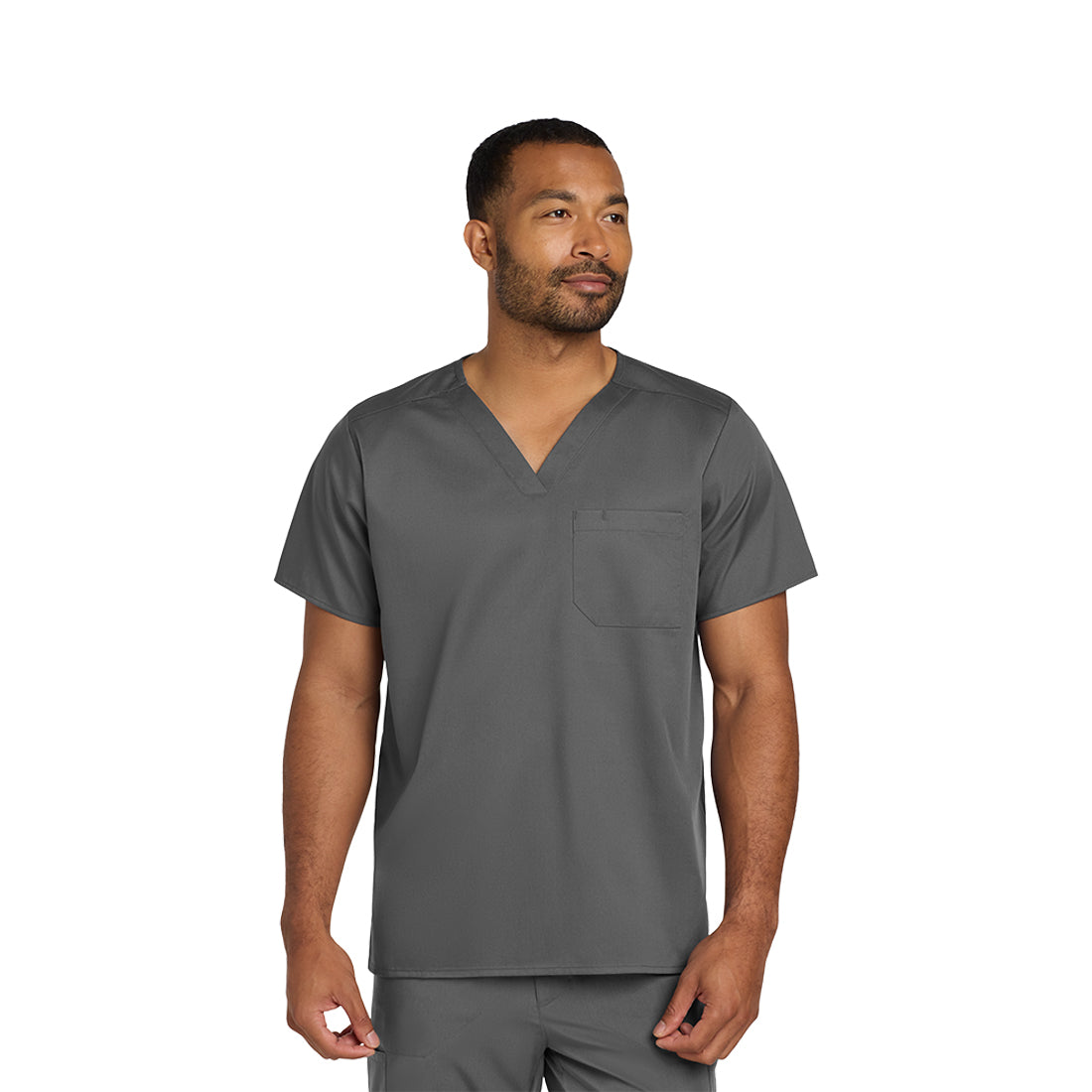 Man wearing a gray scrub set on a white background