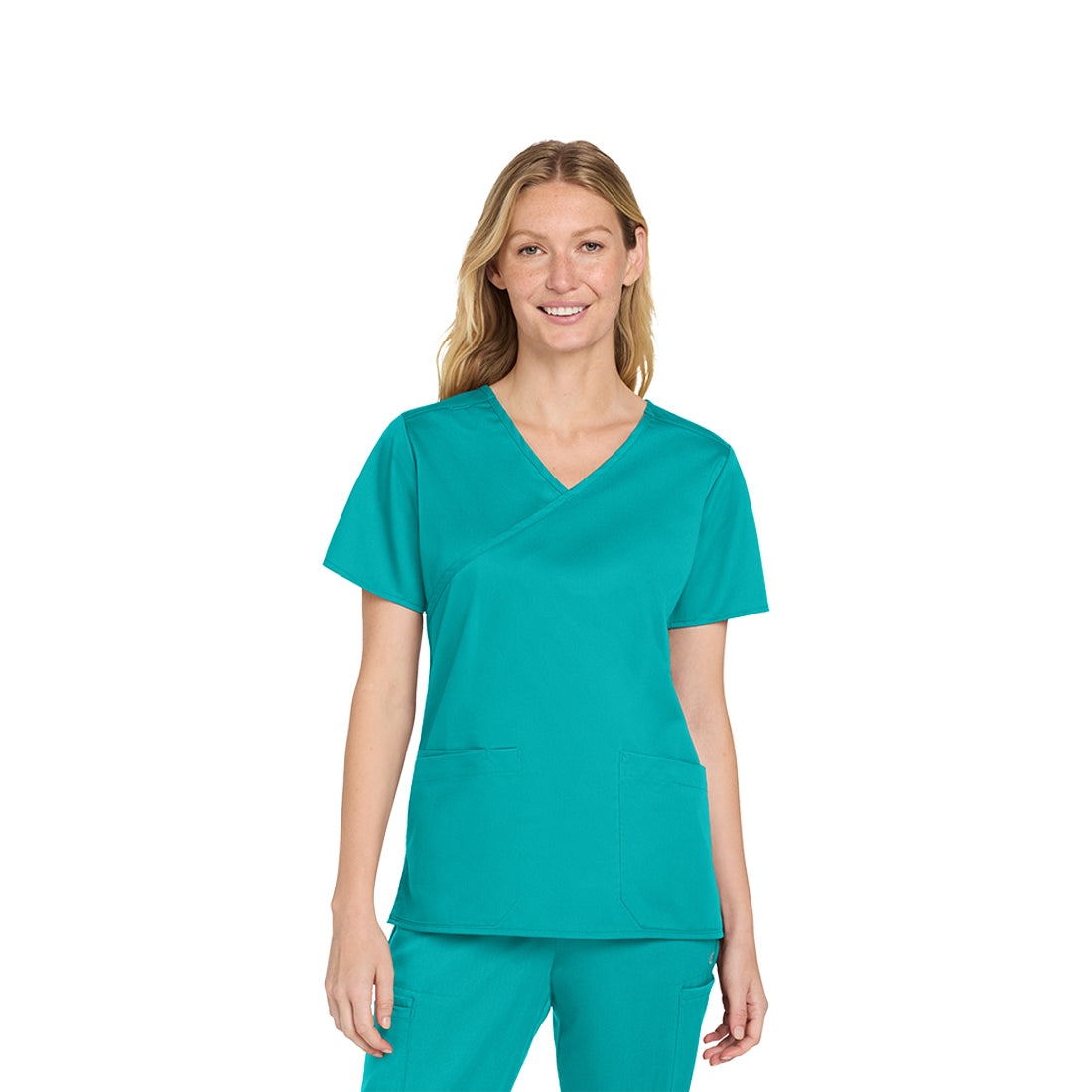 Woman wearing a teal scrub set on a white background