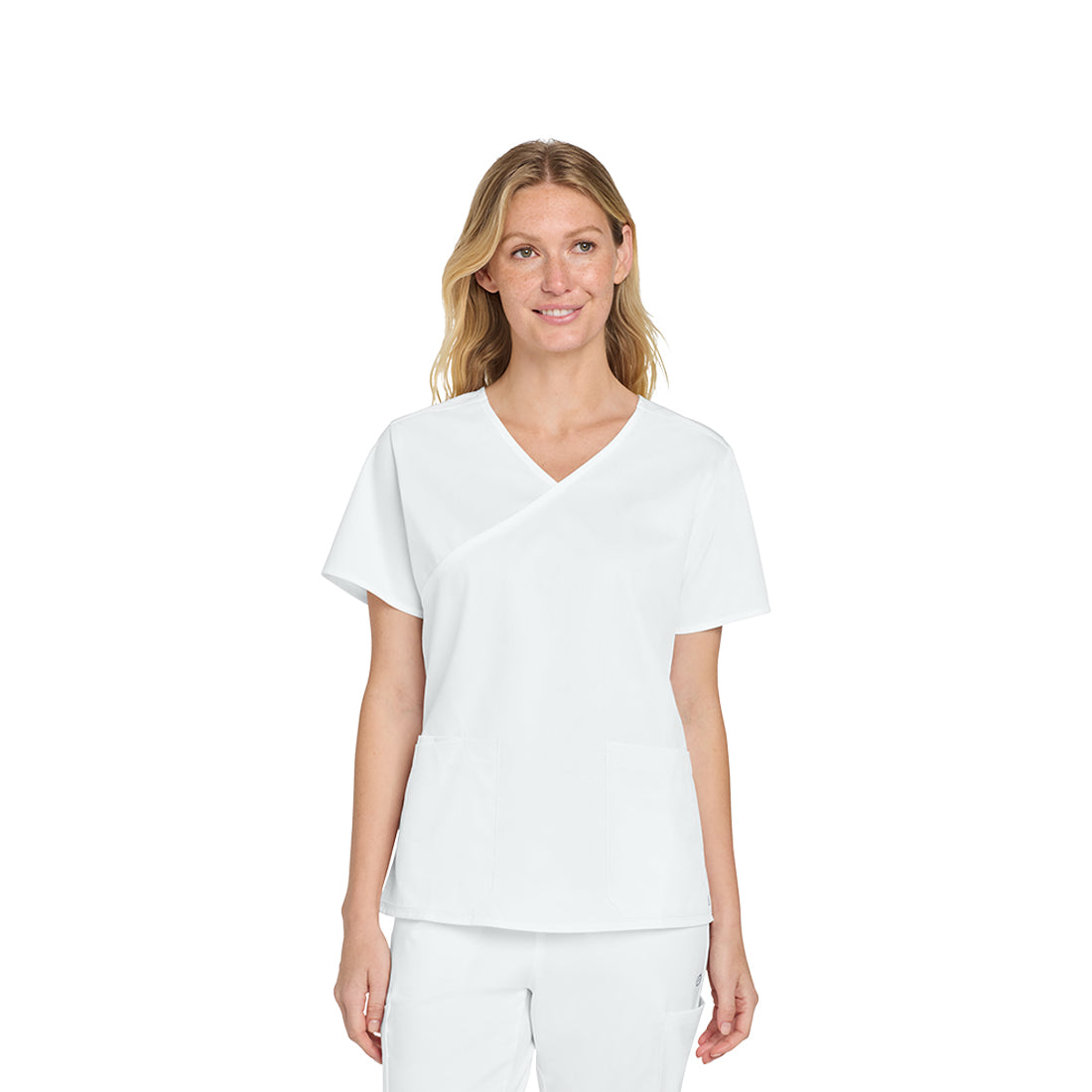 Woman wearing a white scrub set on a white background