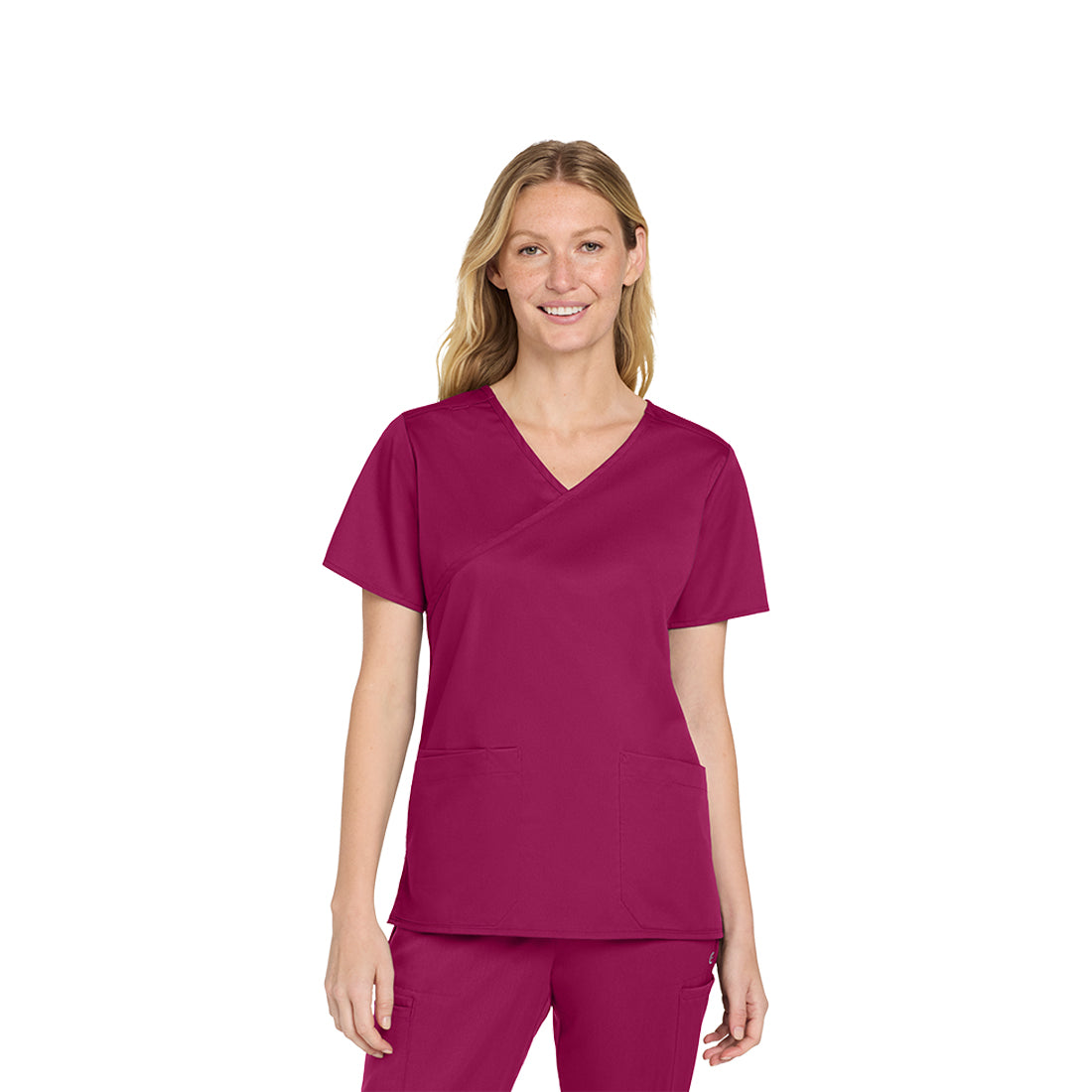 Woman wearing a wine scrub set on a white background