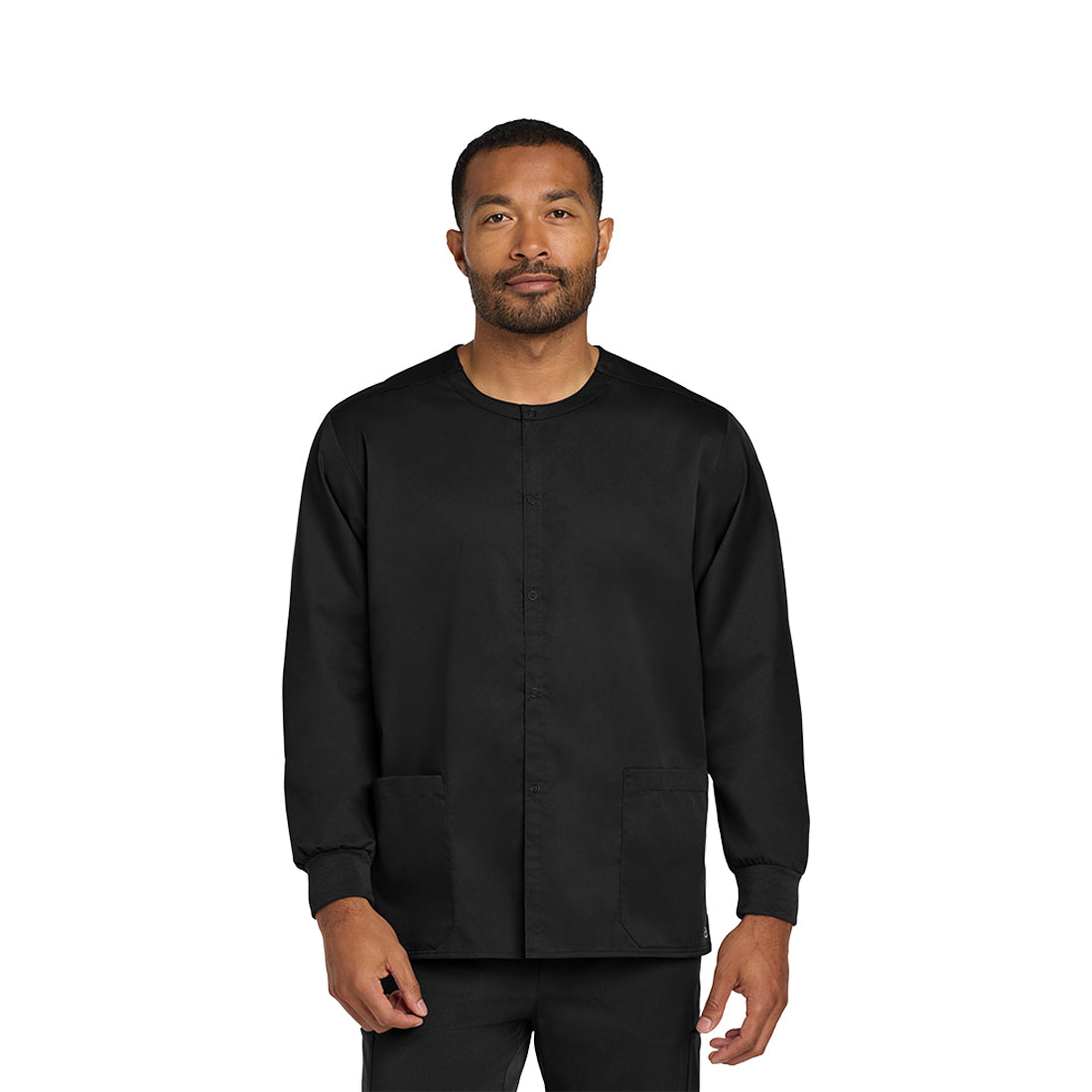 Man wearing a black scrub set on a white background