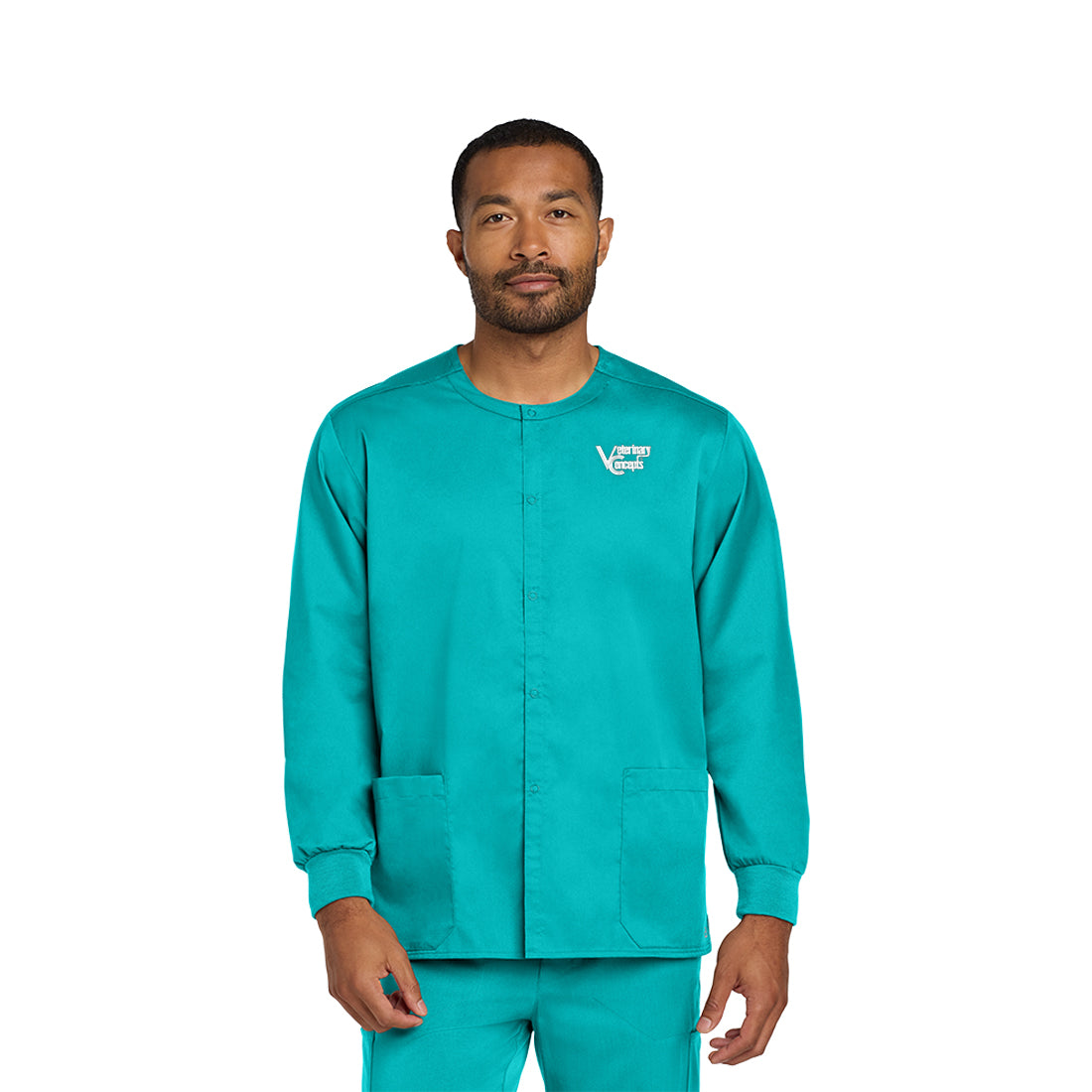 Man wearing a teal scrub set on a white background