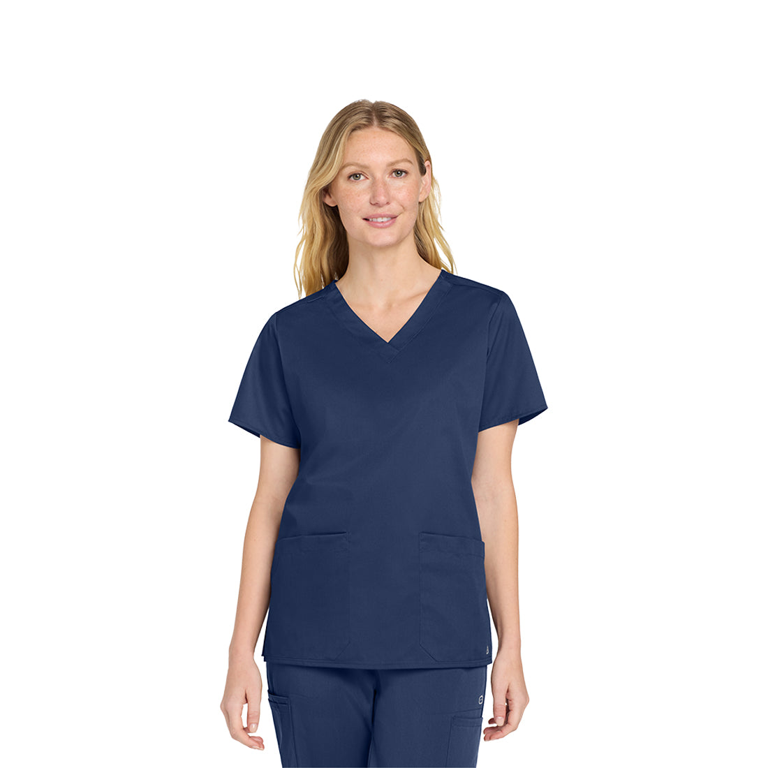 Woman wearing a navy blue scrub set on a white background