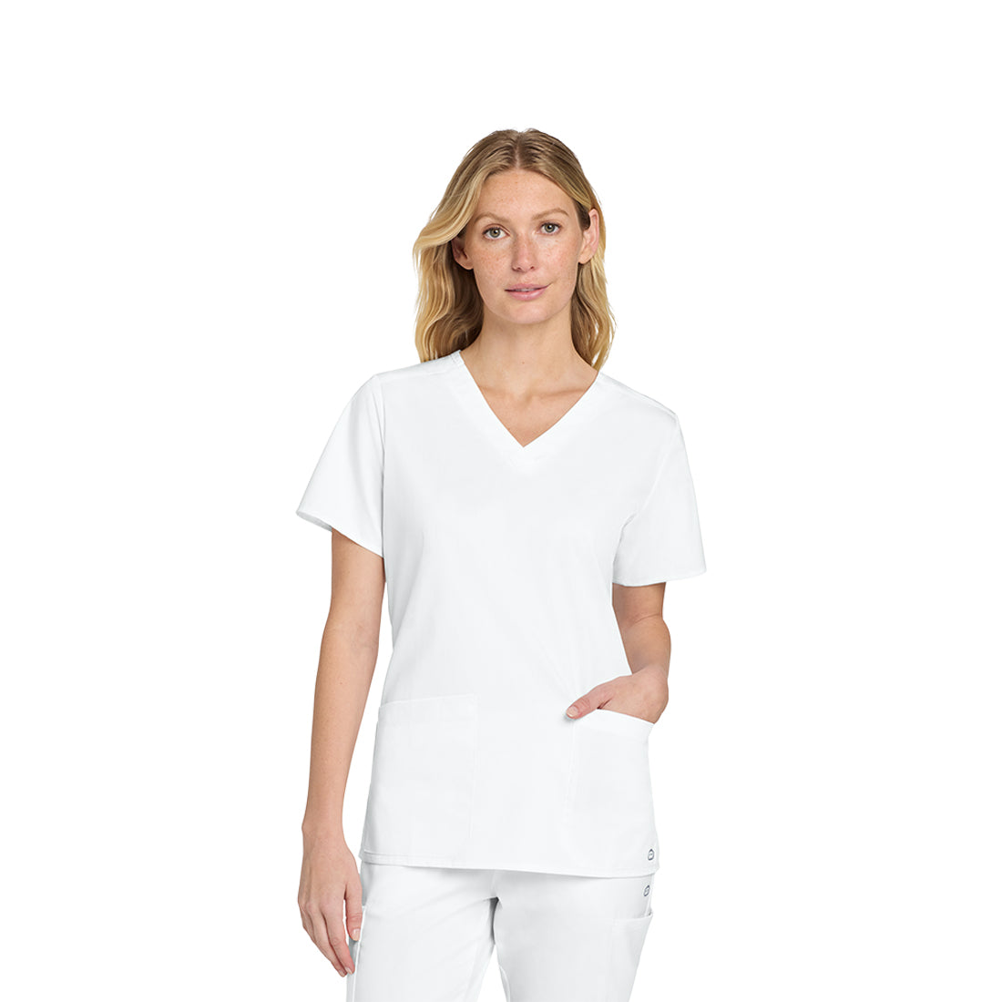 Woman wearing a white scrub set on a white background